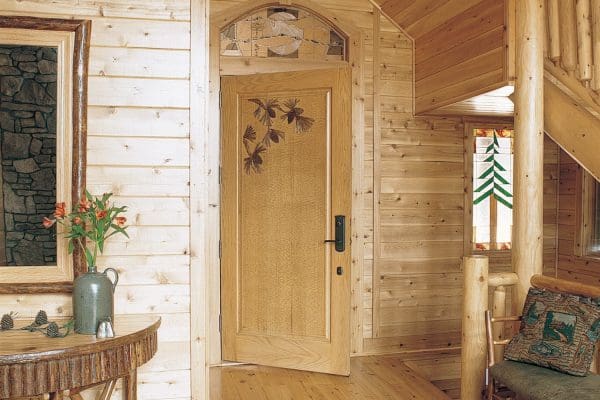 Entrance to master bedroom with decorative wooden door