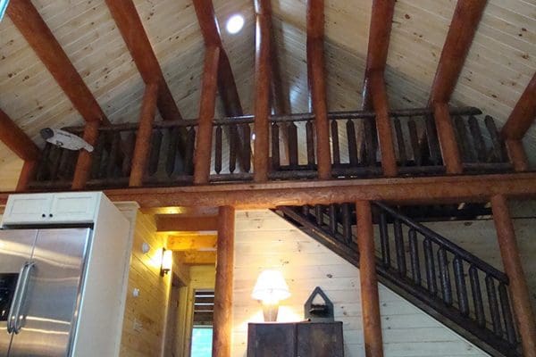 A view of the loft in this log cabin home.