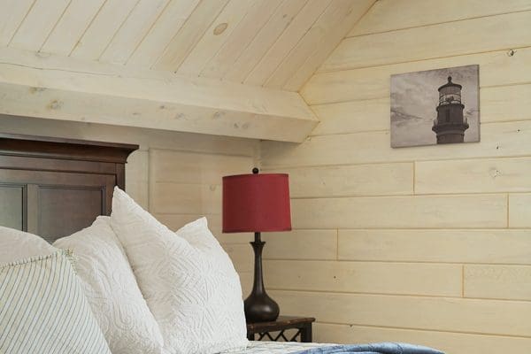 Exposed wood beams give this bedroom a cozy feel.
