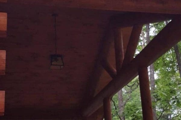 Details of the front porch on a log home.