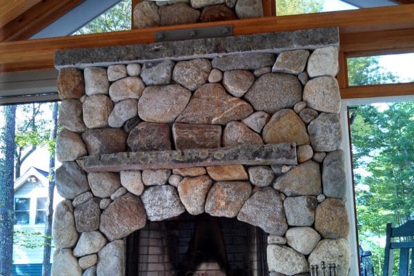 closeup of outdoor fireplace in sunroom